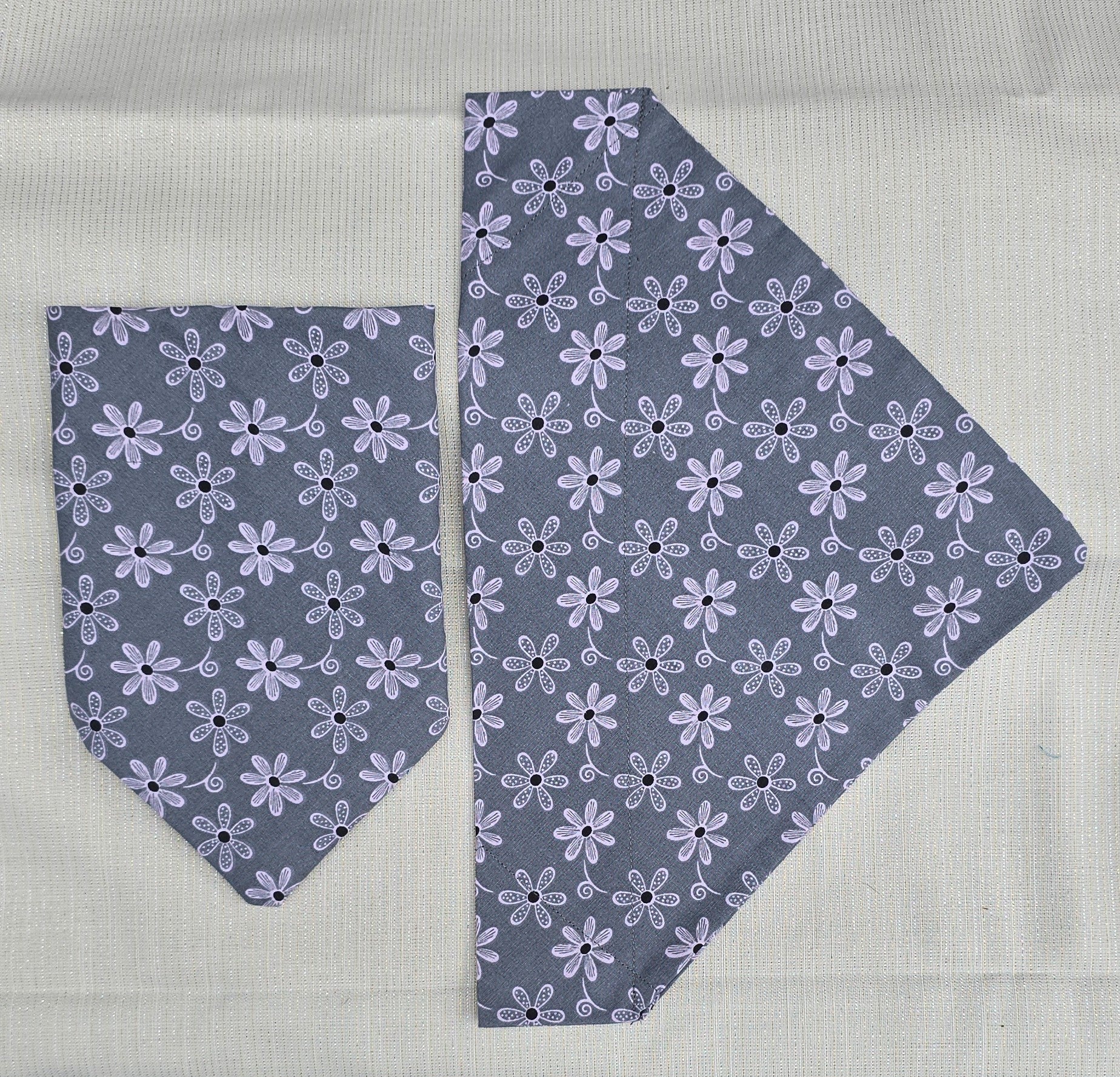 Gray dog bandanas with pink flowers.